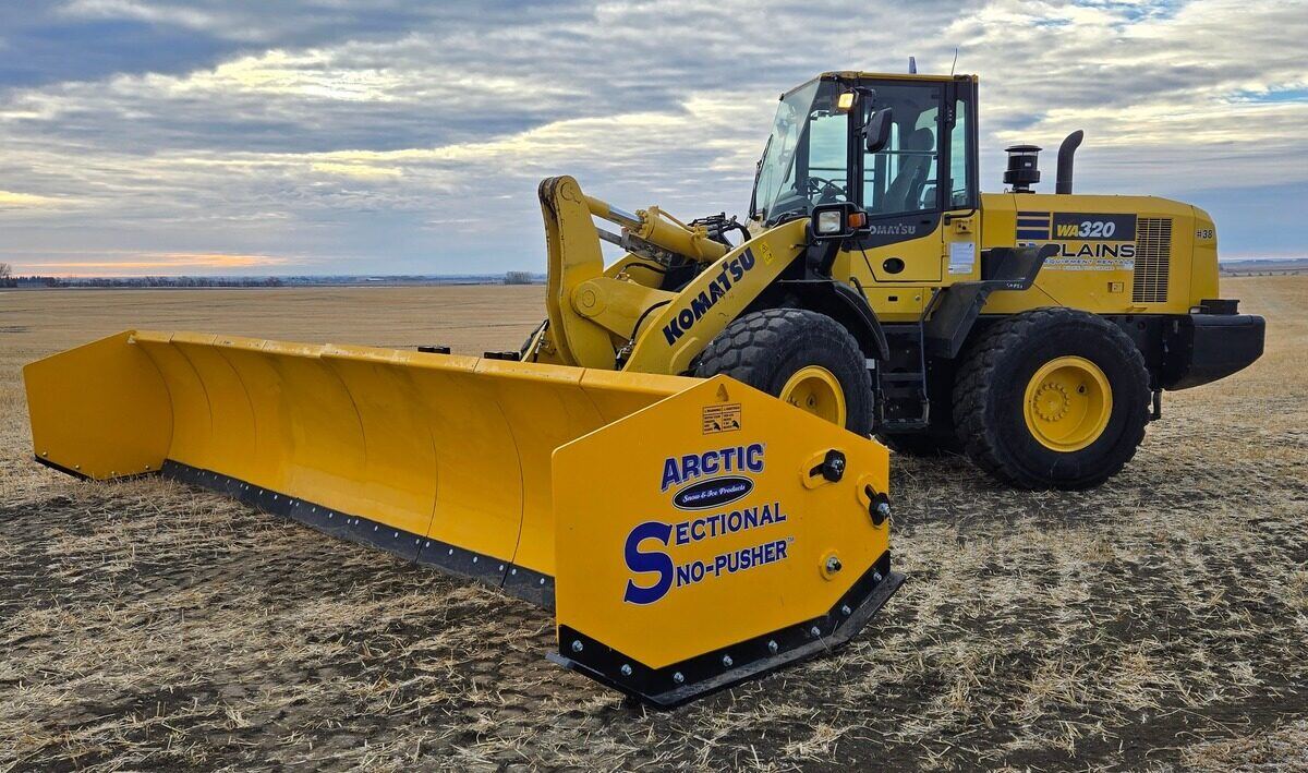 Komatsu-WA320-loader-with-Arctic-sectional-snow-pusher-from-Plains-Equipment-Rentals-available-across-Western-Canada